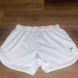 white gymshark shorts